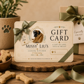 A personalized dog gift card for 'Missy Liu's Canine Kitchen & Grooming' styled on a rustic wooden surface with dog bones, a green ribbon, and a gift box in the background.